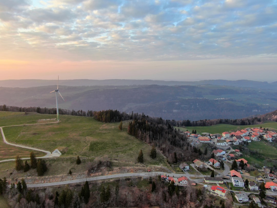 a-wind-turbine-on-top-of-a-hill-d0nmnolty8c